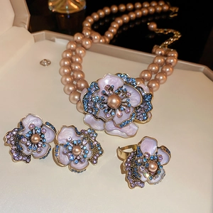 Detail of vintage flower jewelry set with pearls and crystals in a luxury gift box