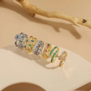 Detailed close-up of luxurious double-layer geometric rings with zircon on stone