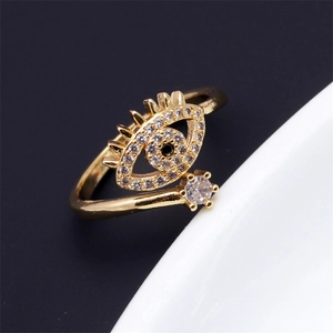 Macro detail of gold devil eye ring featuring micro-pave colorful cubic zirconia stones