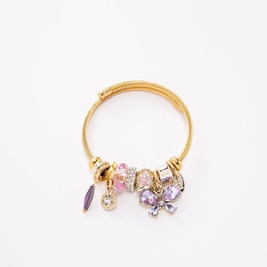 Gold stainless steel wire bracelet with purple butterfly and tassel charm dangles