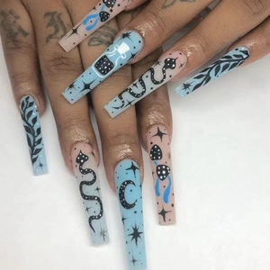 Long almond press-on nails featuring celestial moon, star, and snake patterns in blue and nude