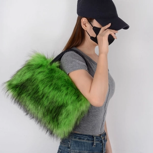 Detail of green faux fur tote bag showing plush texture and black shoulder strap