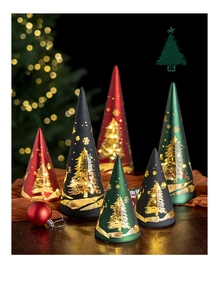 Close-up of conical Christmas tree lanterns with hollow snowflake patterns and LED warm light