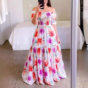 Off-shoulder floral maxi dress with smocked bodice and layered tiered skirt in white