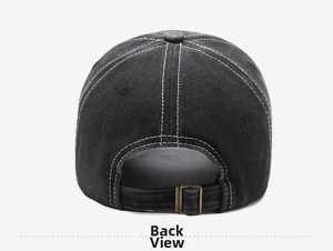 Detail view of washed cotton baseball cap featuring white stitching and bronze metal buckle