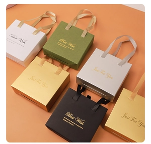 Detailed view of luxury jewelry gift boxes in various colors with elegant silk handles