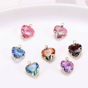 Set of seven heart-shaped colorful zircon crystal pendants with gold-plated metal base