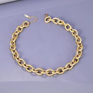 Detail of gold chunky choker chain with textured spiral links and S925 engraved clasp