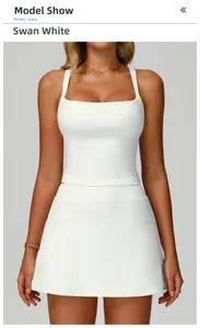 Front view of Swan White sports yoga tank top and matching skirt set on model