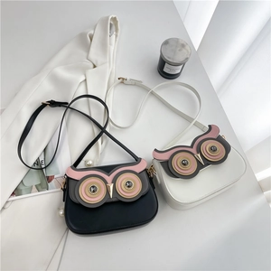 Cute owl-shaped PU leather crossbody bag in black and white with adjustable strap