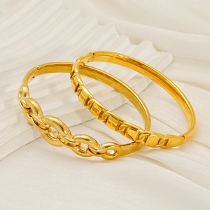Set of two gold-plated stainless steel bangles with chain and geometric link textures