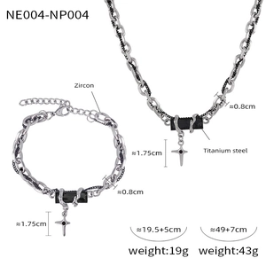 Detail of titanium steel necklace and bracelet set with black zircon and cross charm