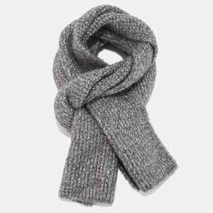 Close-up of thick melange gray knit scarf showing detailed texture and warm soft wool