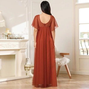Elegant brick red maternity gown with ruffled sleeves and an open back tulle design