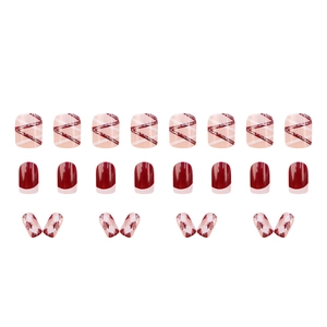 Pink and red checkered press-on nails set with glitter accents in medium square shape