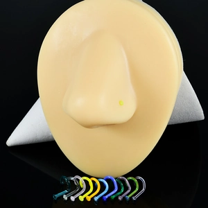 L-shaped colorful nose studs set shown on a silicone model with various vibrant acrylic colors