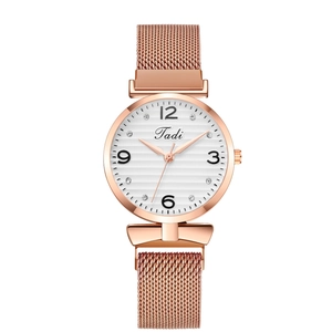 Women's rose gold quartz watch with a mesh strap and textured diamond dial