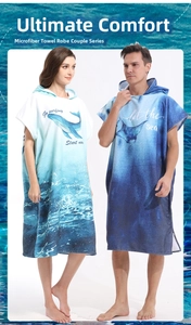 Detail of couple microfiber hooded ponchos with whale and ray ocean prints for beach and surfing