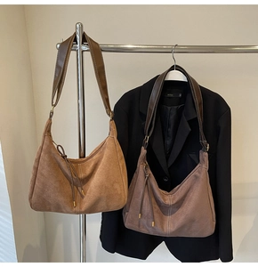 Detailed view of the coffee brown suede tote bag with drawstring and soft matte texture