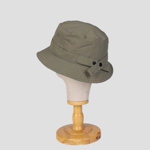 Detail of army green outdoor bucket hat featuring ripstop fabric and adjustable side strap