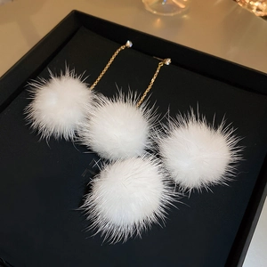 White mink fur ball drop earrings with gold chain and crystals in a gift box