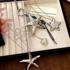Y2K style silver star and heart pendant necklace with textured vintage metallic finish