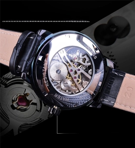 Macro detail of transparent stainless steel case back showing mechanical gear movement