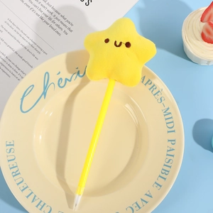 Yellow plush star ballpoint pen with a cute smiley face on a decorative plate