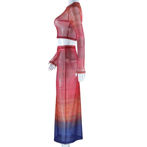 Detail of the high-waisted midi skirt in red, orange, and blue gradient mesh fabric