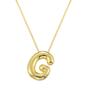 Macro shot of polished gold balloon letter G pendant on a sleek box chain necklace