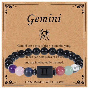 Close-up of Gemini constellation bracelet with multicolor crystal beads on display card