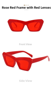 Detail view of bold rose red cat-eye sunglasses with thick frames and matching red lenses