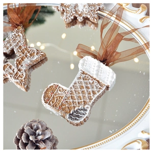 Christmas gingerbread ornaments including star and snowflake on a mirror tray