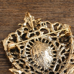 Detailed back view of vintage hollow teardrop brooch showing the safety pin fastener