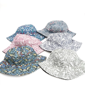 Detailed grid of six reversible cotton sun hats featuring classic vintage floral patterns