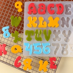 Detailed silicone mold showing colorful resin alphabet and number DIY jewelry pieces