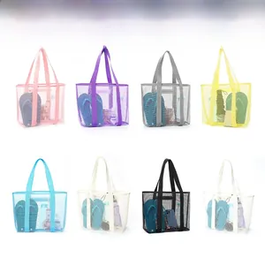 Detail view of large mesh beach bags in eight colors showing spacious storage capacity