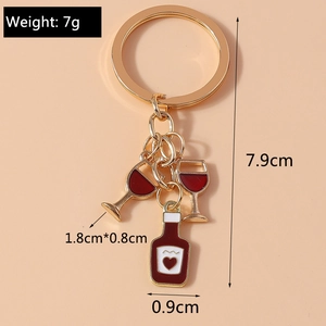 Detailed view of gold keychain with dimensions 7.9cm and wine glass charm measuring 1.8x0.8cm