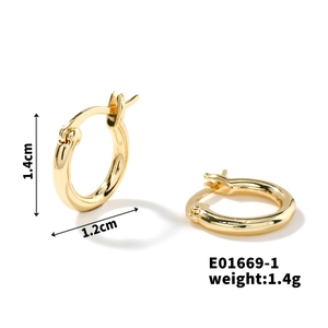 Macro shot of gold geometric hoop earrings showing size 1.4cm height and 1.2cm width