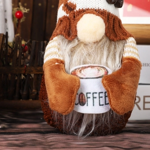 Detail of coffee gnome holding a 'COFFEE' cup with knitted textures and cow print hat