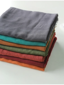 Close-up of high-quality linen texture fabric in a range of solid vintage colors