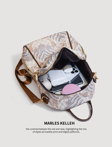 Internal capacity of the vintage pattern backpack showing umbrella, phone, and notebook