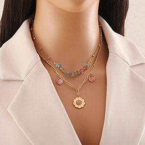 Double-layered gold necklace featuring colorful stone beads and pink floral pendants