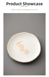 Detail of 4-inch irregular white ceramic jewelry tray with gold love text and rim