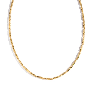 Close-up of golden stainless steel geometric chain links with a polished metallic finish