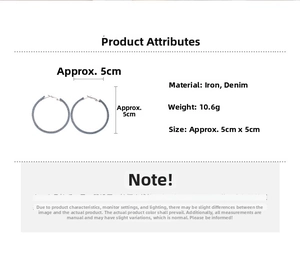 Detail showing blue denim wrapped hoop earrings with 5cm diameter and 10.6g weight