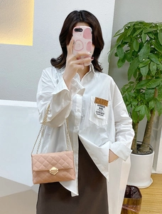 Pink quilted PU leather shoulder bag with gold chain strap and geometric metal lock detail