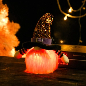 Light-up Halloween gnome with sequin hat and glowing beard on rustic wood background