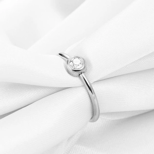 Minimalist 2mm silver stainless steel ring with round zirconia on white silk