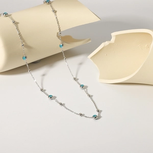18K gold plated stainless steel necklace with blue evil eye beads and silver balls